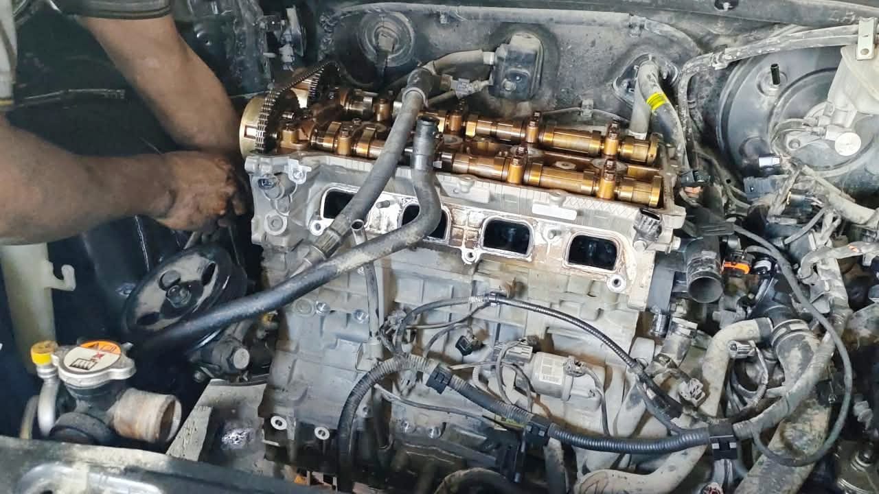 Sanjoy Auto Repair workshop and technician working on a car in Al Mankhool Dubai